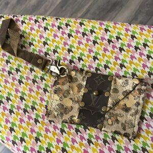 Louis Vuitton Leopard Print Wristlet with Gold Accents